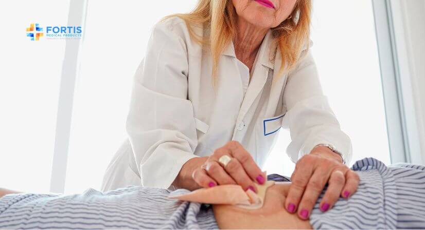 nurse helping patient with ostomy